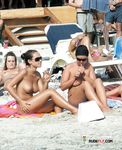 Dazzling blonde sits around with her massive, natural tits before lying down and showing smooth pussy 3