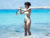 A delectable couple enjoys their time at the beach like a real nudist family 2