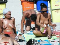 Unwinding on a Colorful Beach Towel in the Sun