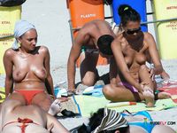 Unwinding on a Colorful Beach Towel in the Sun
