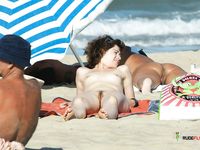 Adult naturist chicks have fun at the beach