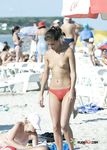 She sunbathes on her stomach with her firm ass and tight holes showing 4