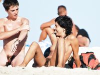 Stunning and curvy blonde MILF with short hair is loving her time in nudist camp as she is oiling her body that includes massive pierced tits 2