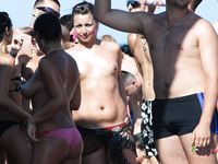 This beautiful nude beach girl shows off her perky tits before lying down with her pussy and ass secretly filmed