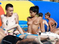 Sunlit Rest on a Beach Towel — Topless With Ocean Views Behind
