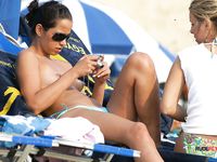 Two hot family nudist sisters lay naked next to each other on the beach as the eyes of the passing bys go from their tits to their sexy feet