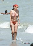 Dazzling blonde lies on her stomach with her firm butt showing and pale brunette sunbathes her perky tits 3