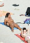 This slim beauty loves flaunting her stunning, supple breasts while tanning 4