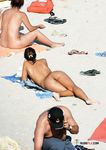 This slim beauty loves flaunting her stunning, supple breasts while tanning 4