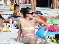 Holding a Patterned Item on a Busy Topless Beach