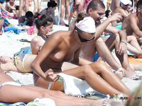She walks around showing off her beautiful breasts before lying down and spreading legs, leaving her pussy and ass on display 3