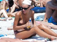 She walks around showing off her beautiful breasts before lying down and spreading legs, leaving her pussy and ass on display 3