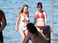 Sexy nudist girl enjoys being naked in the sea and loves to hang out with her other nude friends at the beach 2