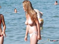 Sexy nudist girl enjoys being naked in the sea and loves to hang out with her other nude friends at the beach 2