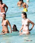 She poses and teases before being photographed with her perky tits and smooth, shaved pussy showing 3