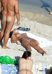 Standing Nude by the Waves on an Open Beach