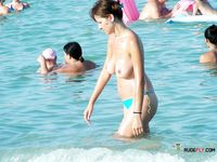Blonde MILF is spending her time in nudist camp enjoying the sun while displaying her natural tits and curvy body as voyeur tapes her every move 2