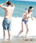 Wading from the Surf Topless in Yellow Bikini Bottoms