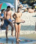 Wading from the Surf Topless in Yellow Bikini Bottoms
