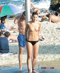 Wading from the Surf Topless in Yellow Bikini Bottoms