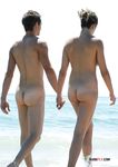 Nudist family caught on a hidden camera enjoying a hot summer day at the beach