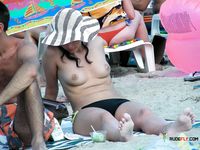 A Casual Topless Stroll Past Outdoor Graffiti in Summer Light