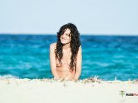 Dashing hotties lie down or sit around sunbathing, with their supple breasts and smoothly shaved pussies on display 2