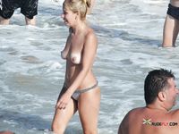 Unaware nudist babes secretly filmed by a voyeur while sunbathing at the beach 2