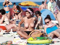 Unaware nudist babes secretly filmed by a voyeur while sunbathing at the beach 2