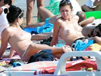 She covers her firm breasts and soft pussy in sunscreen before lying down with her ass showing 4