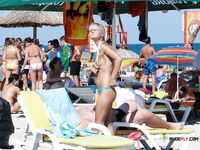 Black Bikini Bottoms Only on a Quiet Topless Beach Stroll