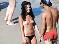 Black Bikini Bottoms Only on a Quiet Topless Beach Stroll