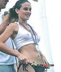 She flaunts her slim body, perky tits, and smooth, shaved pussy while lying in the sand 4