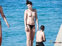 Nudist girl with thin body but fantastic big tits enjoys her time at a naked beach 2