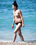 Nudist girl with thin body but fantastic big tits enjoys her time at a naked beach 2