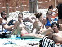 Adorable brunette filmed sunbathing topless during a hot summer day 2