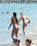 Adorable brunette filmed sunbathing topless during a hot summer day 2