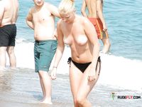 She gets caught on camera sitting topless to tan her slim body and a pair of beautiful, large, natural breasts 4