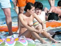 A Quiet Nude Sunbathing Moment on a Sunny Beach Towel