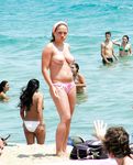 She's at a nudist camp, just having fun