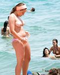She's at a nudist camp, just having fun