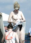Beautiful chicks with slim bodies and perky tits walk around and show off their naughty parts 4
