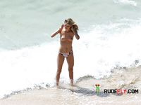 She shows off her perfect ass and her soft, smooth, shaved pussy before being drilled by her boyfriend at the beach 4