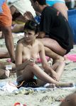 This beautiful nude beach girl shows off her perky tits before lying down with her pussy and ass secretly filmed 3