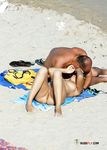 Tanned nudist hottie relaxes in the sun and enjoys a hot summer day at the beach