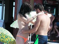 Voyeur sets up a hidden camera to film nudist babes taking an outdoor shower at the beach 2