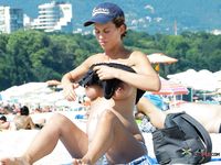 She lays on her towel and lets the sun warm her boobs up really quick 2