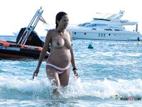 She loves showing off her sensual curves, tiny breasts, and trimmed pussy 3