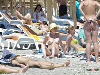Nudist family caught on a hidden camera enjoying a hot summer day at the beach 2
