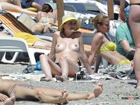 Nudist family caught on a hidden camera enjoying a hot summer day at the beach 2